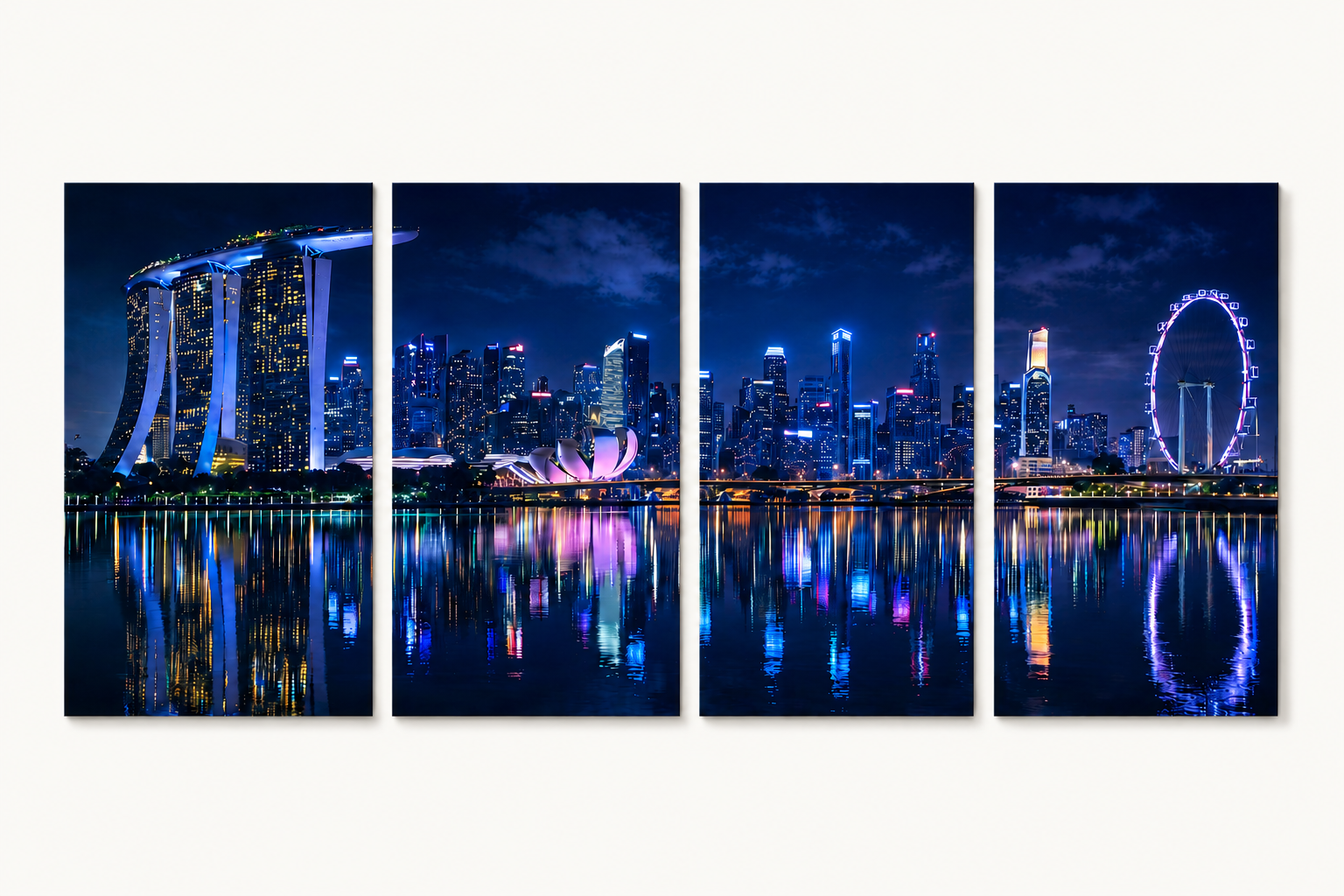 4 Panel Panoramic view of a city skyline at night with illuminated buildings and reflections on water.